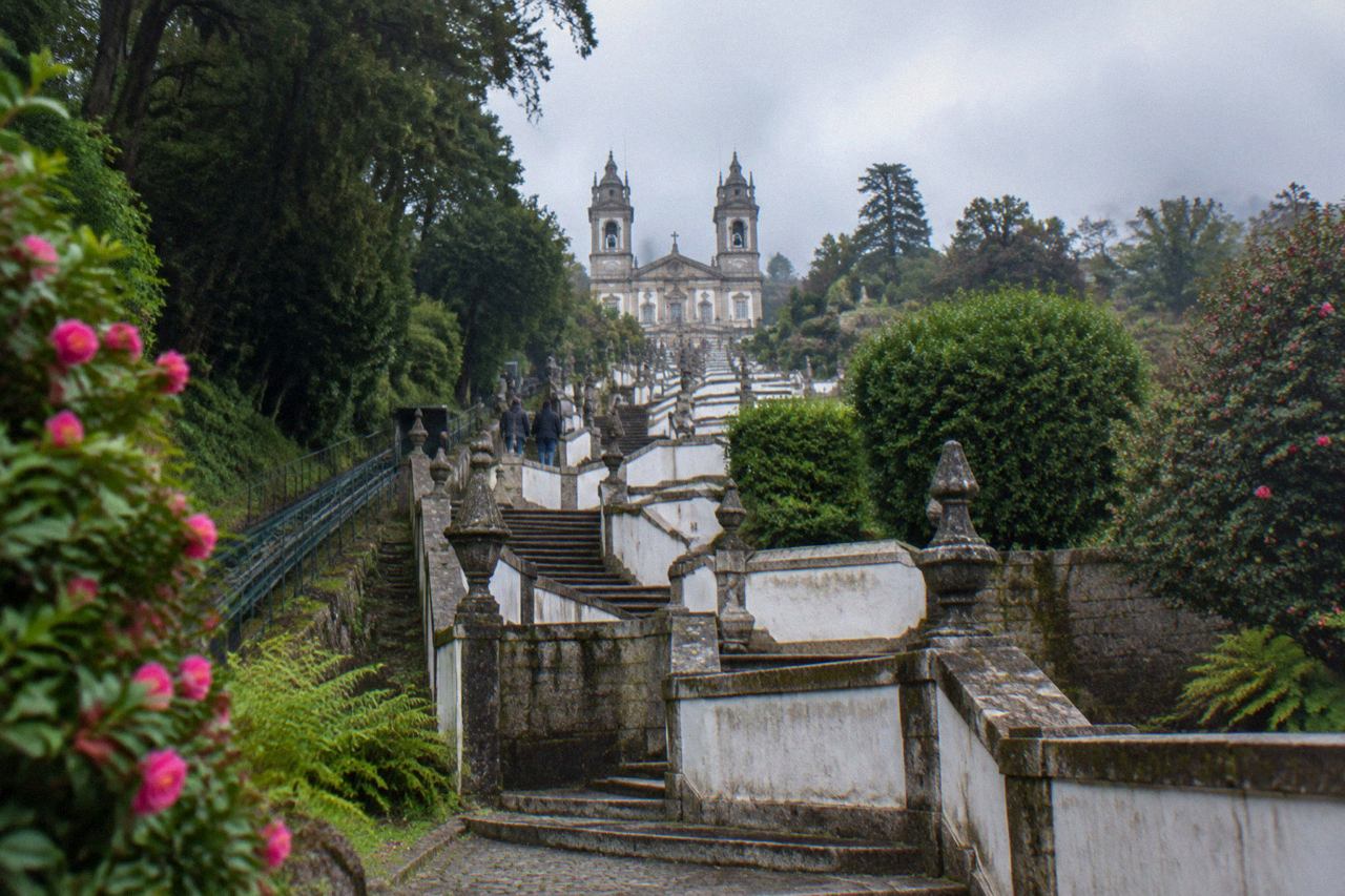 The baroque stairway and sanctuary of Bom Jesus do Monte rising above the wooded hill east of Braga
