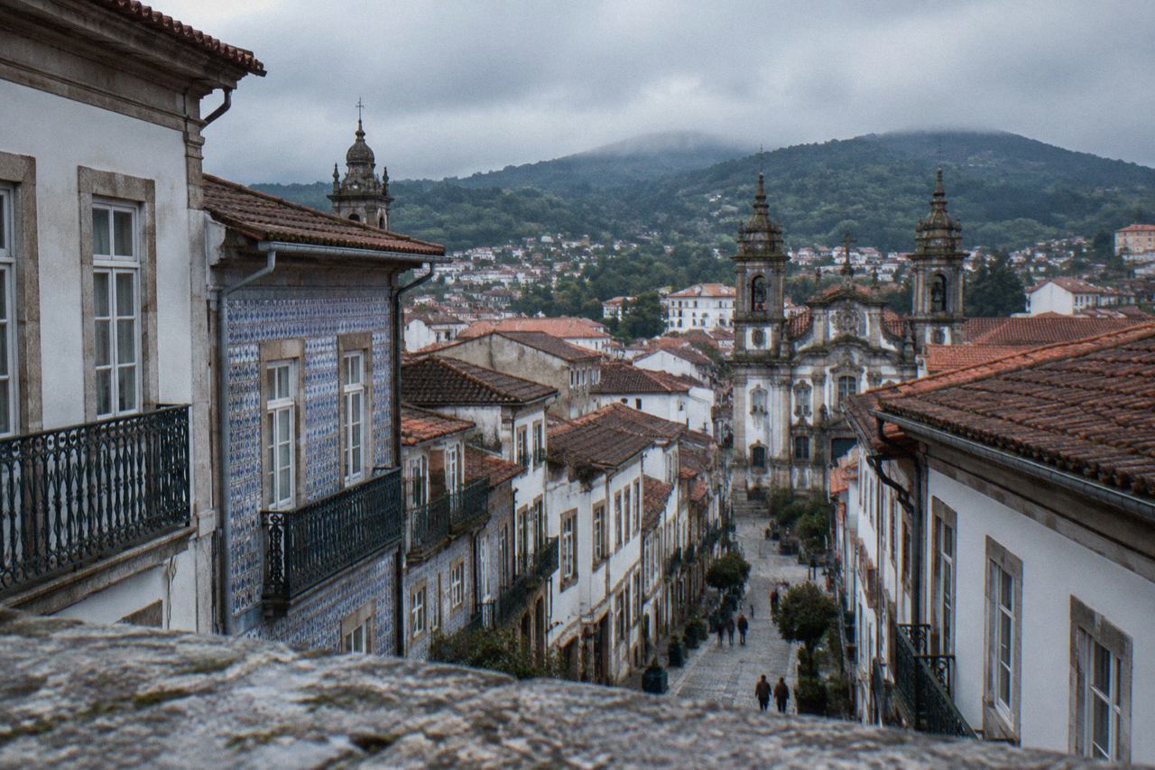 View over Braga's rooftops with church towers and hills in the background