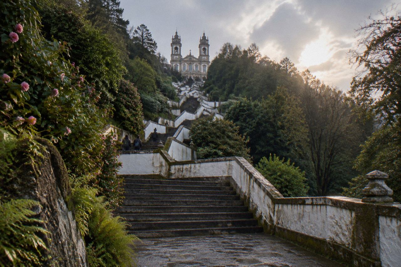 The baroque stairway and sanctuary of Bom Jesus do Monte rising above the wooded hill above Braga