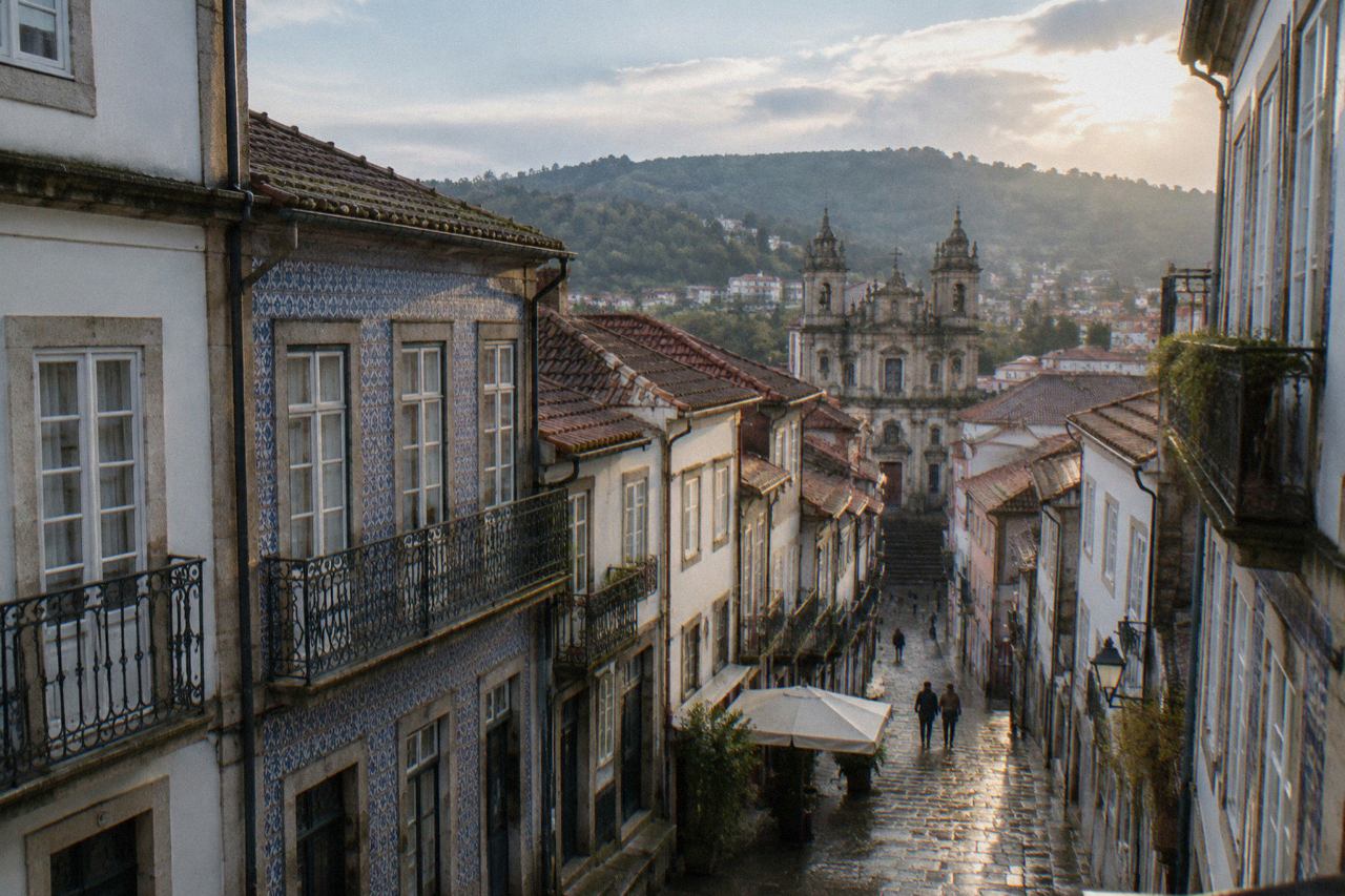 View over Braga's historic centre with church towers and terracotta rooftops under a clear sky