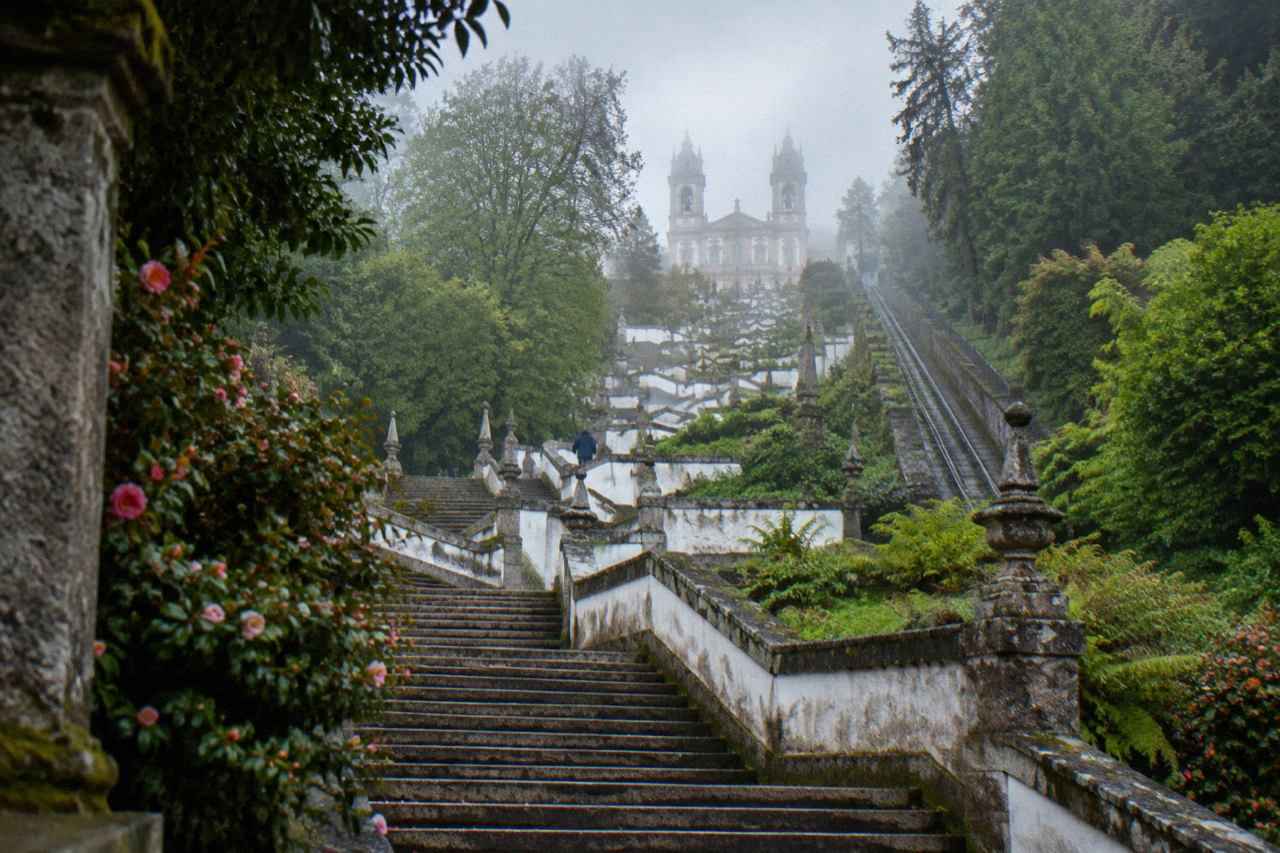 The baroque stairway of Bom Jesus do Monte rising through terraced gardens towards the sanctuary church above Braga