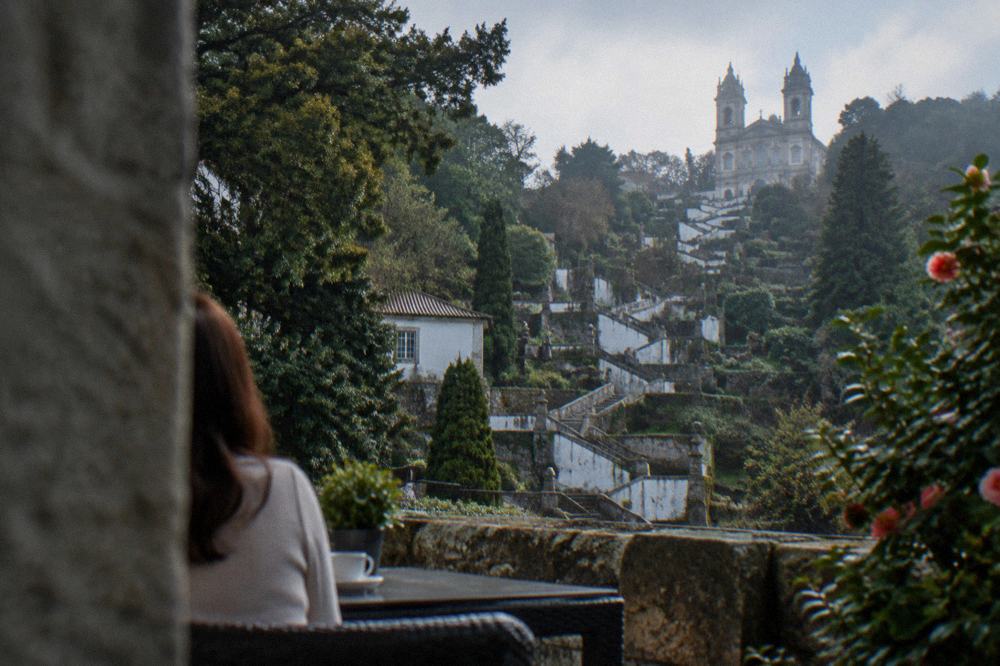 A hotel terrace overlooking the gardens of Bom Jesus do Monte at golden hour