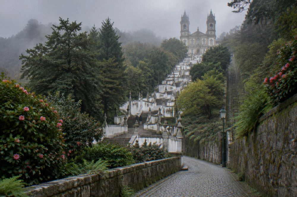 A quiet granite lane in the Tenões parish below the sanctuary