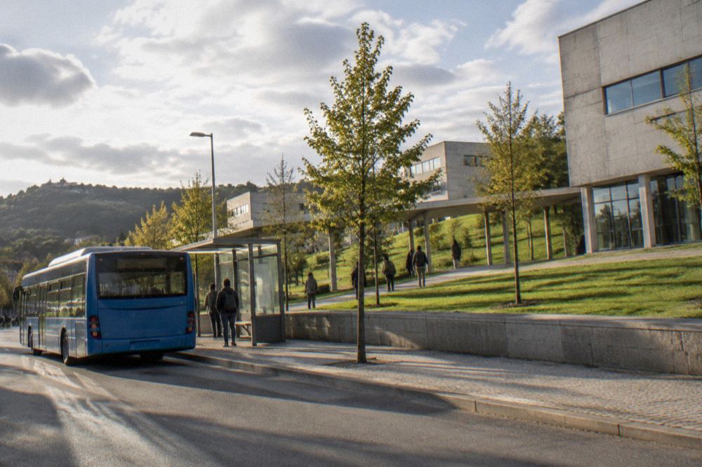 Blue TUB city bus at a stop near the university campus in Braga