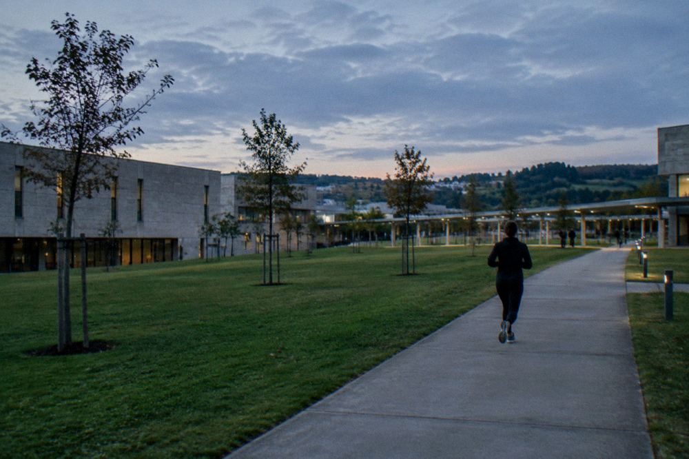 Open green lawn and modern architecture on the university campus at Gualtar