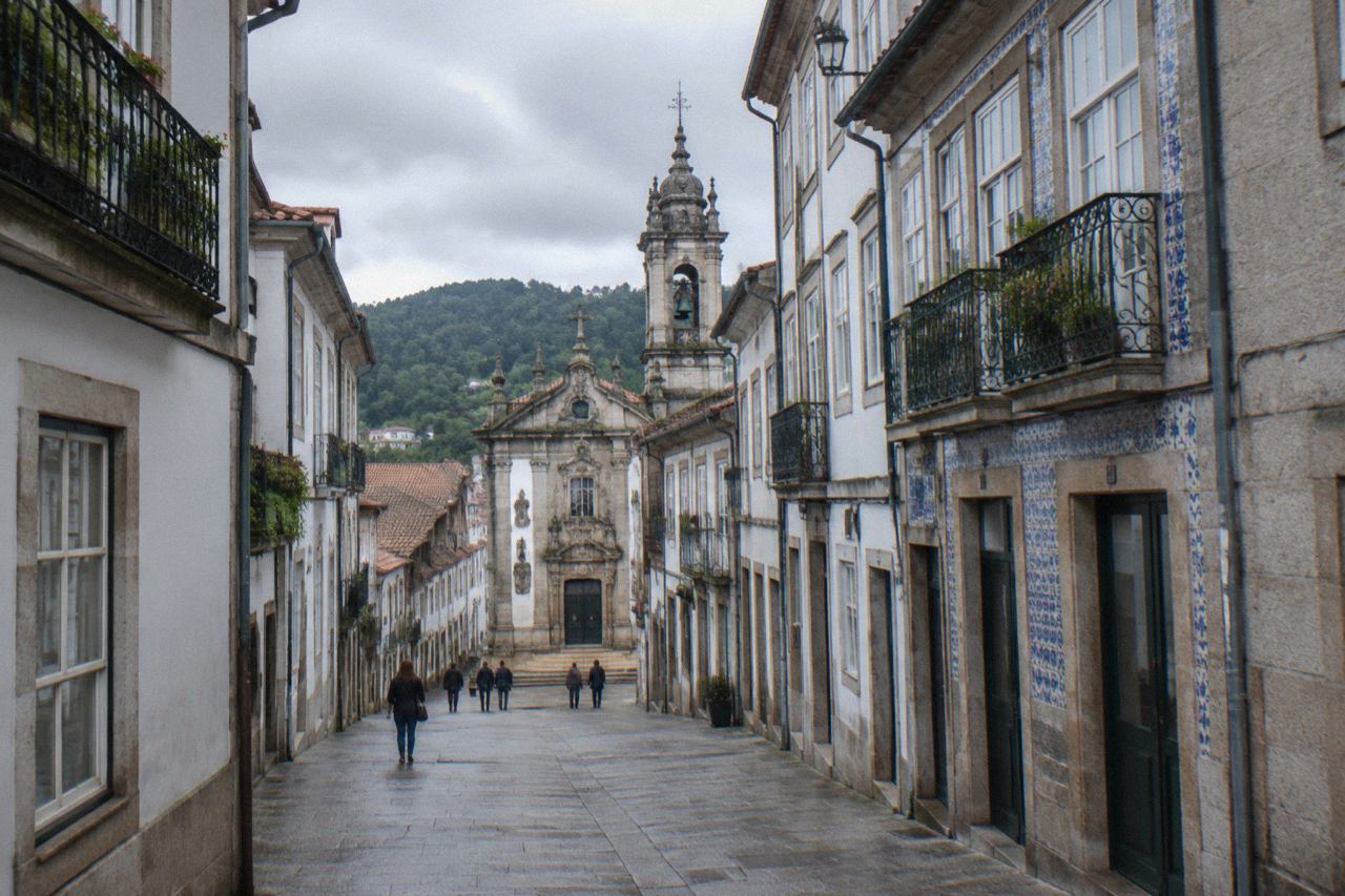 Baroque buildings and a church tower above the rooftops of Braga's old town