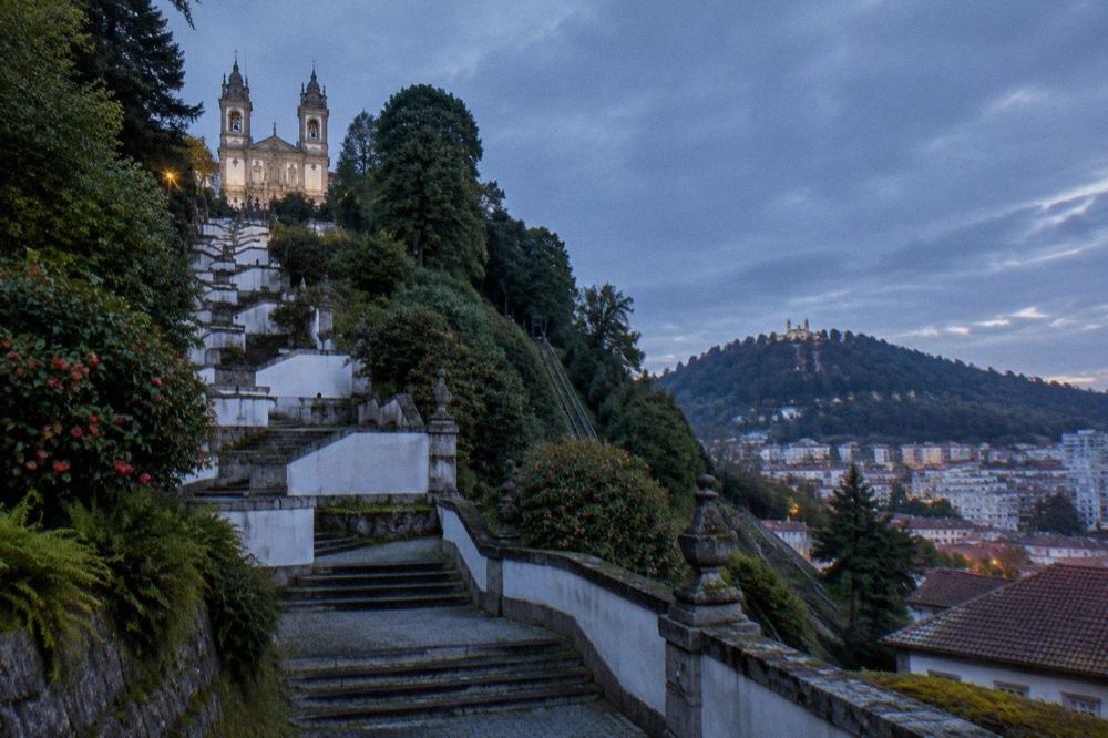 View over rooftops in eastern Braga with the wooded Bom Jesus hill rising beyond the houses