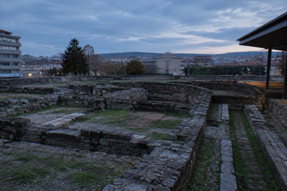 The excavated stone walls and chambers of the Roman baths on the Cividade hill in Braga