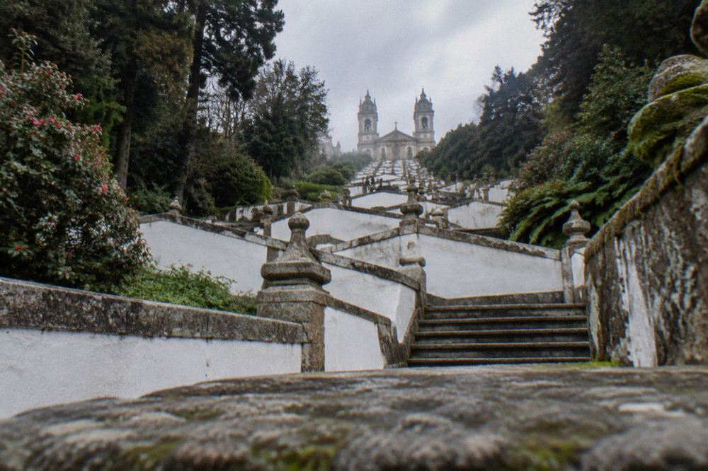 The baroque stairway of Bom Jesus do Monte zigzagging up the wooded hill above Braga