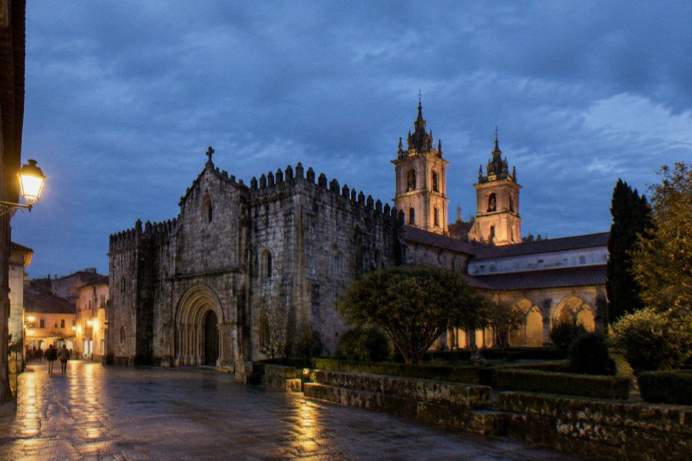The towers of Braga cathedral rising above rooftops in the evening light