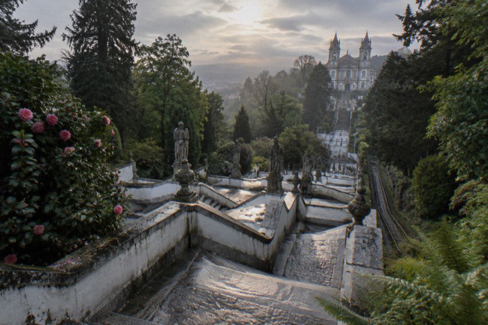 Stone statues lining one of the zigzag stairway landings at Bom Jesus do Monte