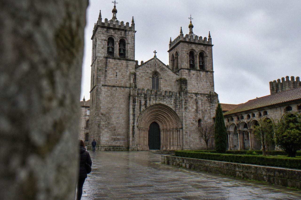 The twin towers and Romanesque portal of Braga Cathedral seen from the square in front of it