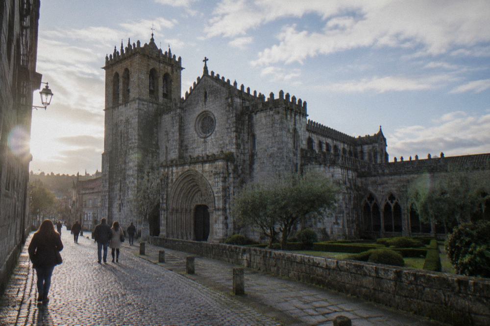 Visitors walking on the cobbled street that leads up to the west front of Braga Cathedral