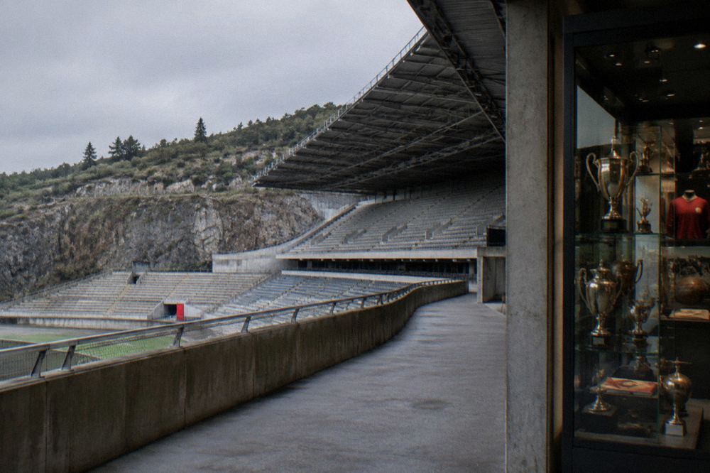 A museum room with glass display cases of football trophies and club memorabilia