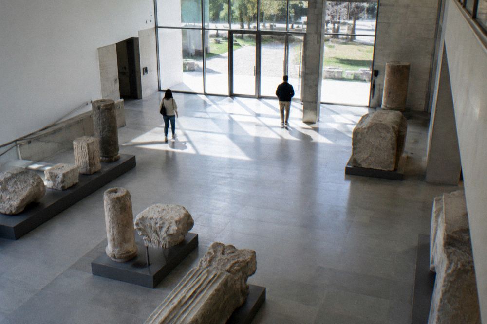 Museum entrance hall with stone architectural fragments on display