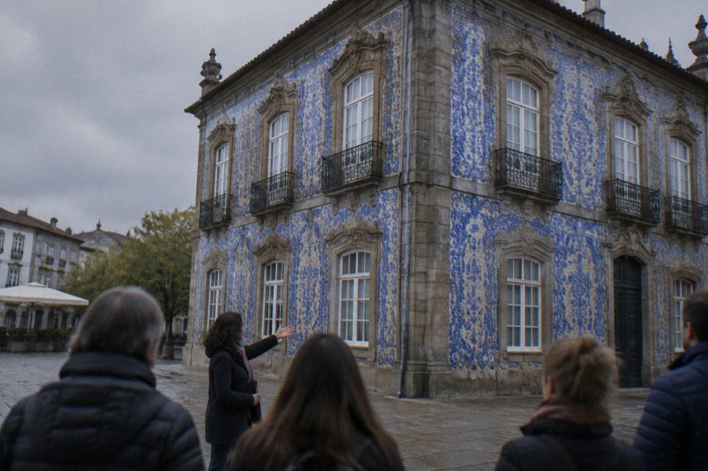 Tour guide speaking to a small group of visitors on a historic city square