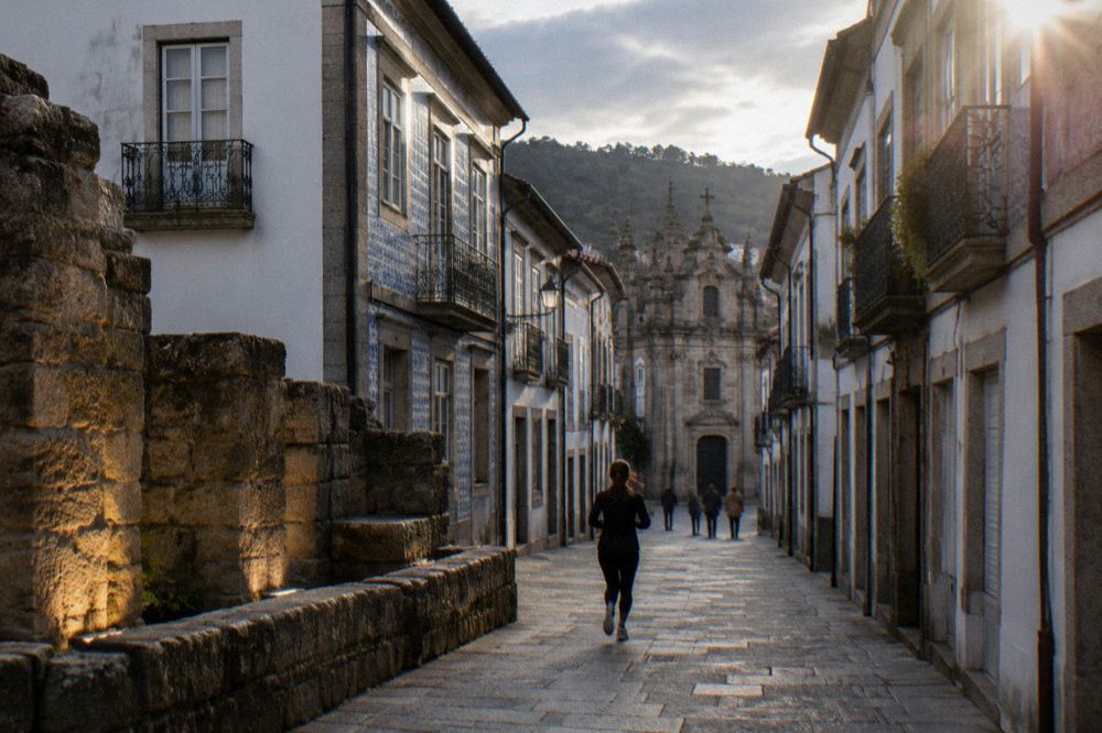 Late afternoon light on excavated Roman stone walls in Braga