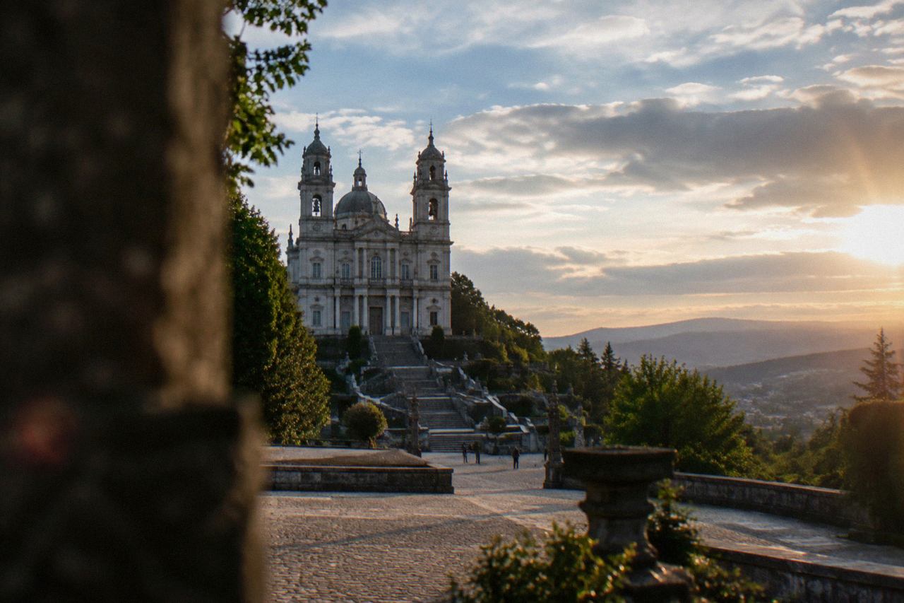The twin-towered basilica of Sameiro seen from its paved forecourt in late afternoon light