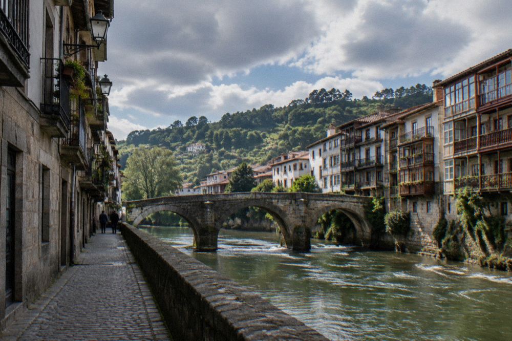 Narrow granite street with traditional balconied houses in Amarante's historic centre