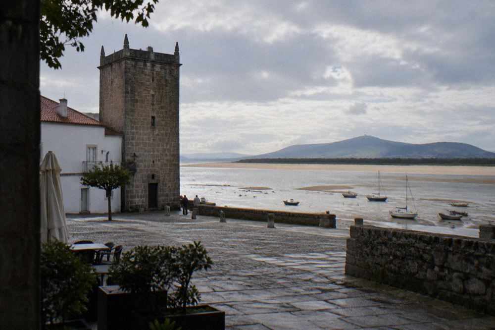 The tidal estuary of the Minho at low tide with sandbanks and moored small boats