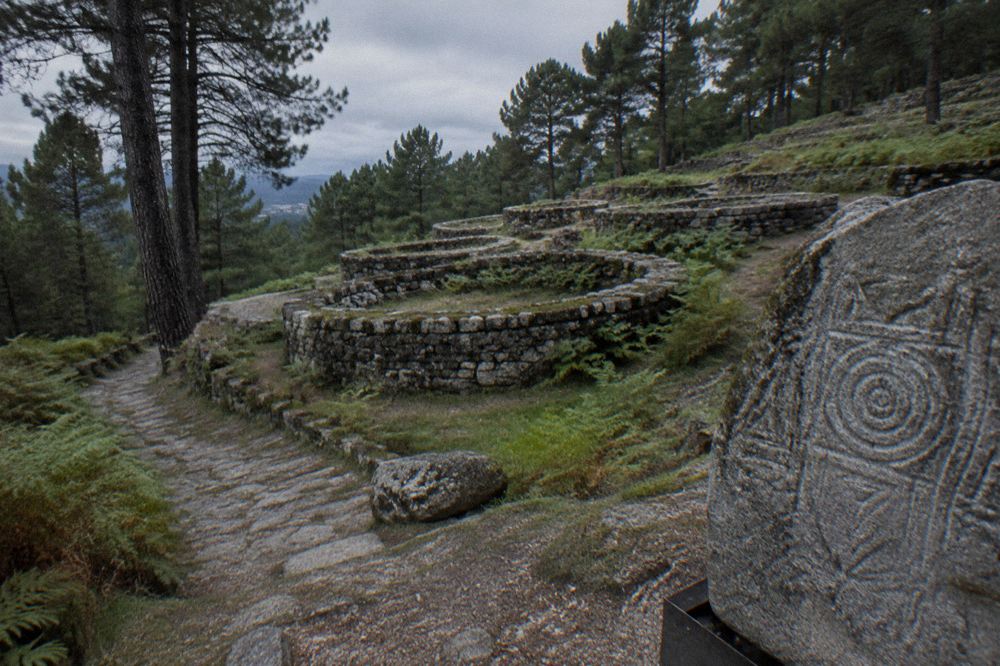 Carved granite stone with geometric castro artwork displayed at the museum