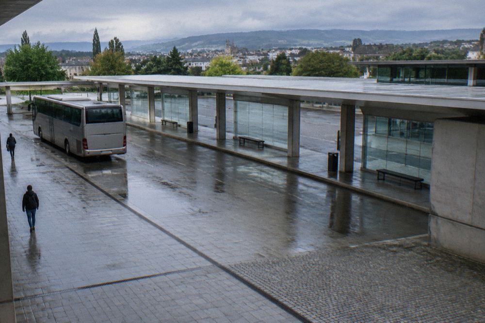 A regional bus parked at a small intercity bus station in northern Portugal