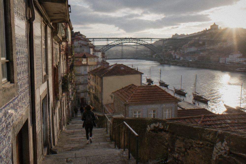 Narrow stepped lanes and colourful tiled facades in Porto's Ribeira quarter above the river