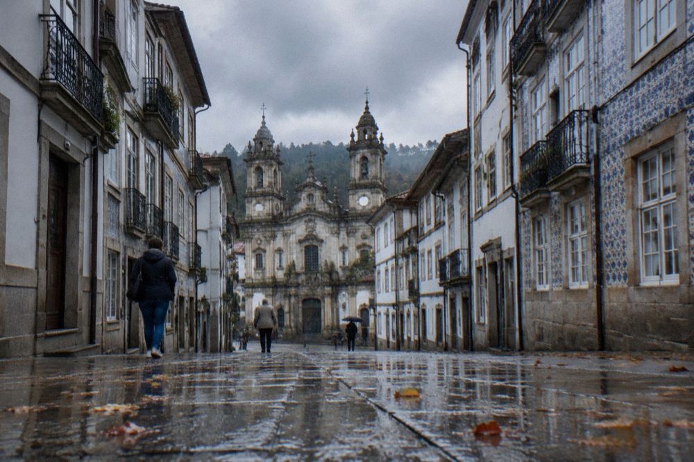 Rain clouds passing over the rooftops and church towers of Braga on an autumn day