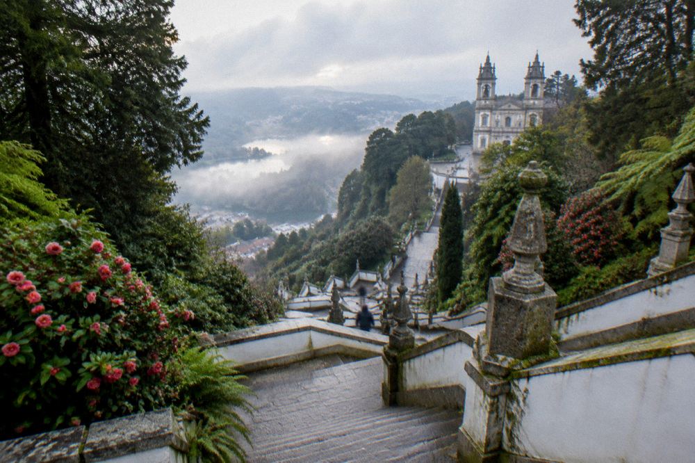 Morning mist clearing over the lakes and wooded slopes below the Bom Jesus sanctuary in Braga
