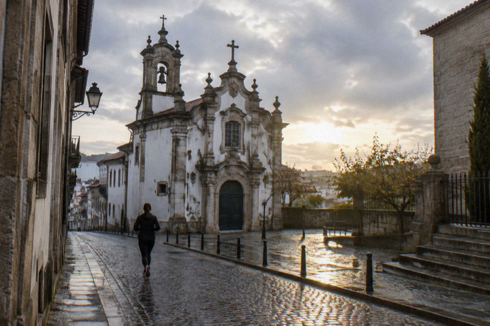 The ornate baroque facade of the Igreja do Pópulo seen from the street