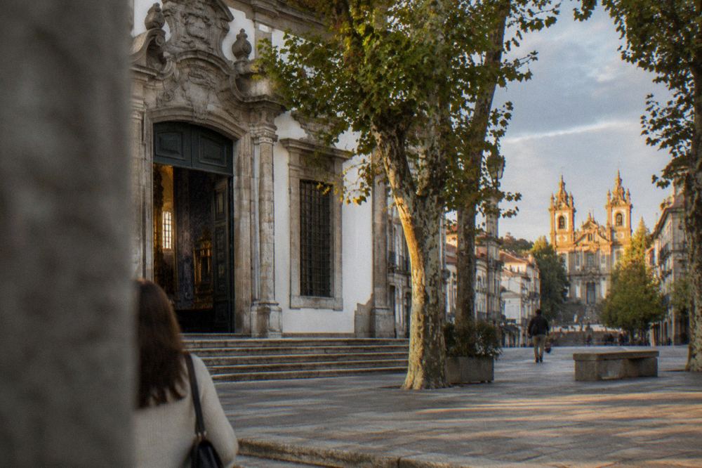 Sunset light on the twin towers of the Congregados Basilica at the top of Rua do Souto