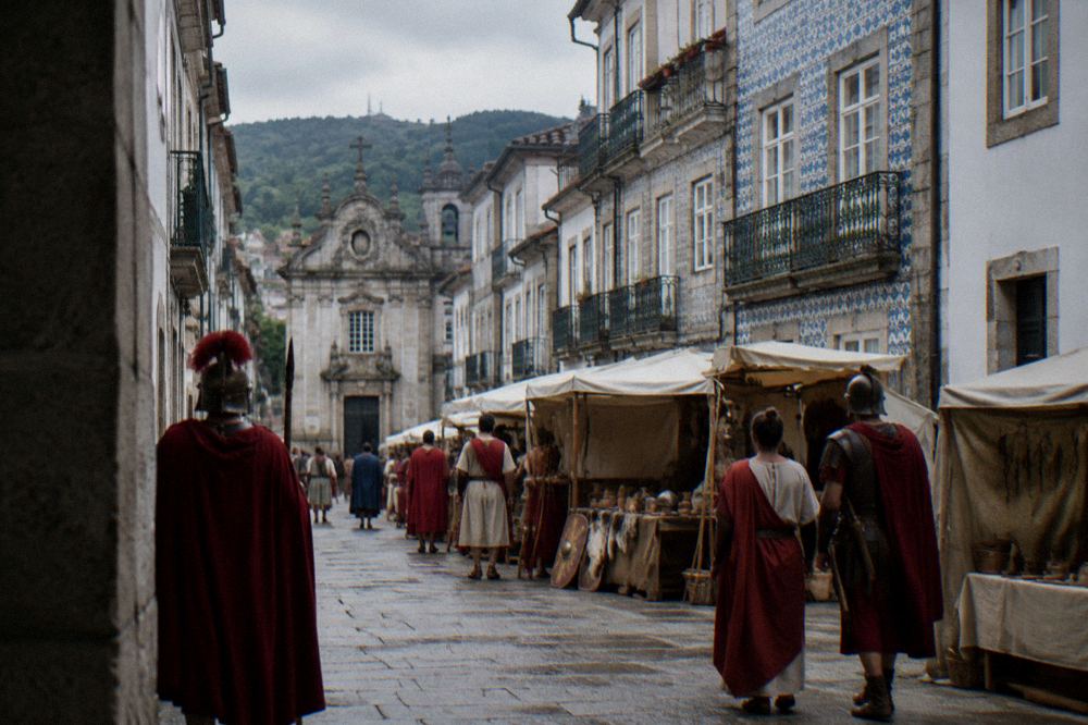 People in Roman costumes at a historical reenactment market in Braga