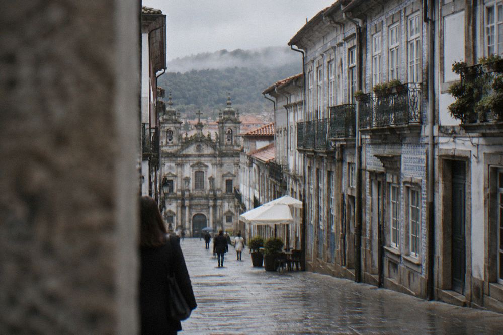 A photography exhibition hung in a historic stone building in Braga