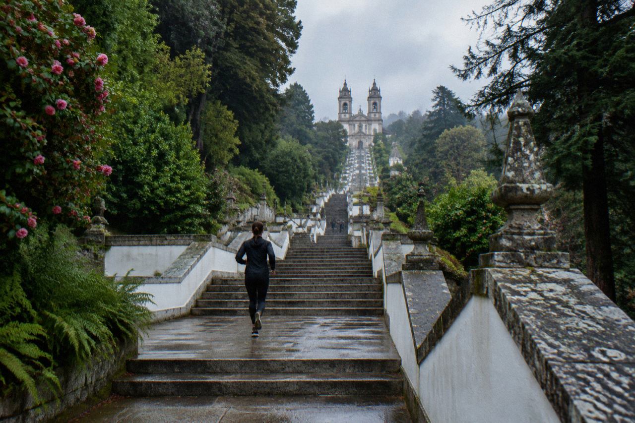 The baroque stairway of Bom Jesus do Monte rising through trees towards the sanctuary above Braga