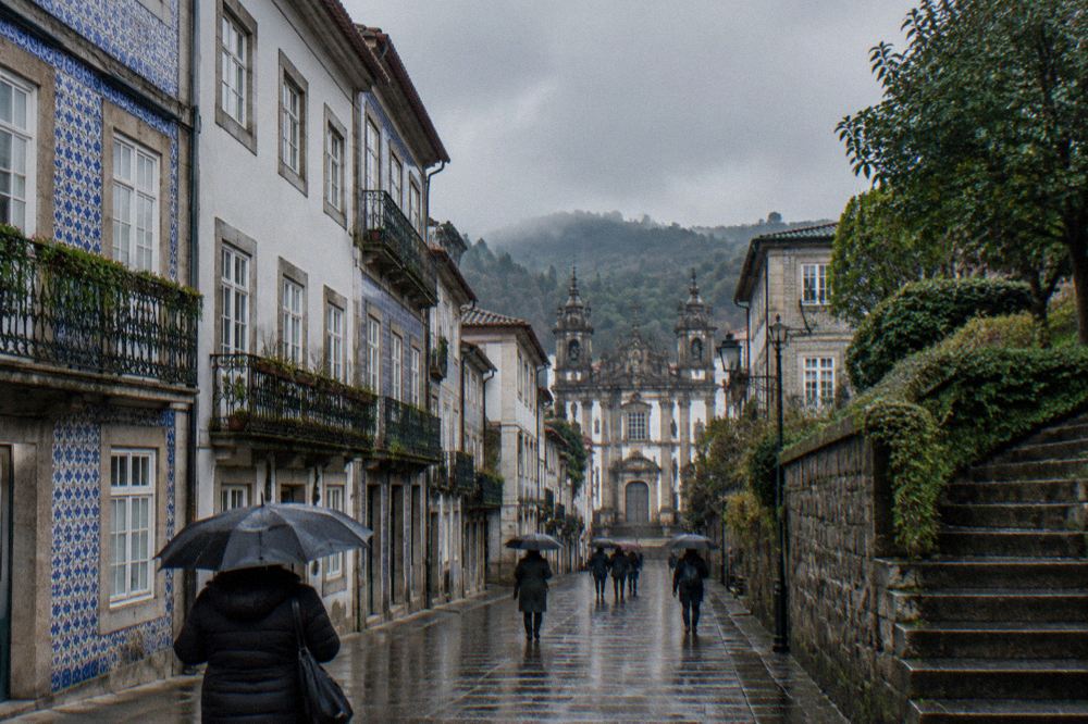 The palace and castle walls of Guimarães historic centre on a misty winter morning