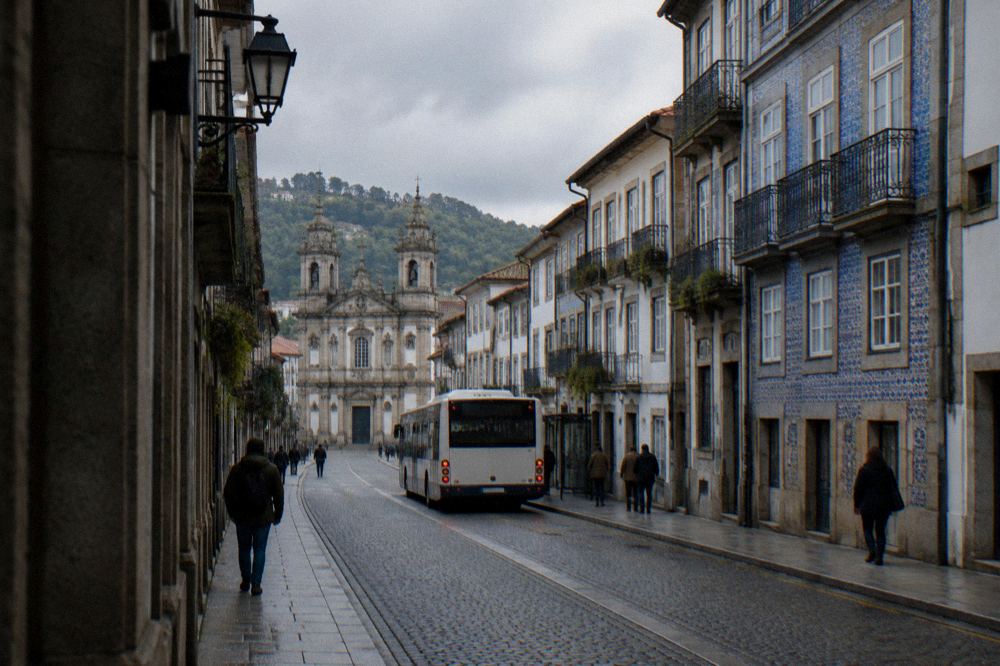 A city bus stopping on a street in Braga near the historic centre
