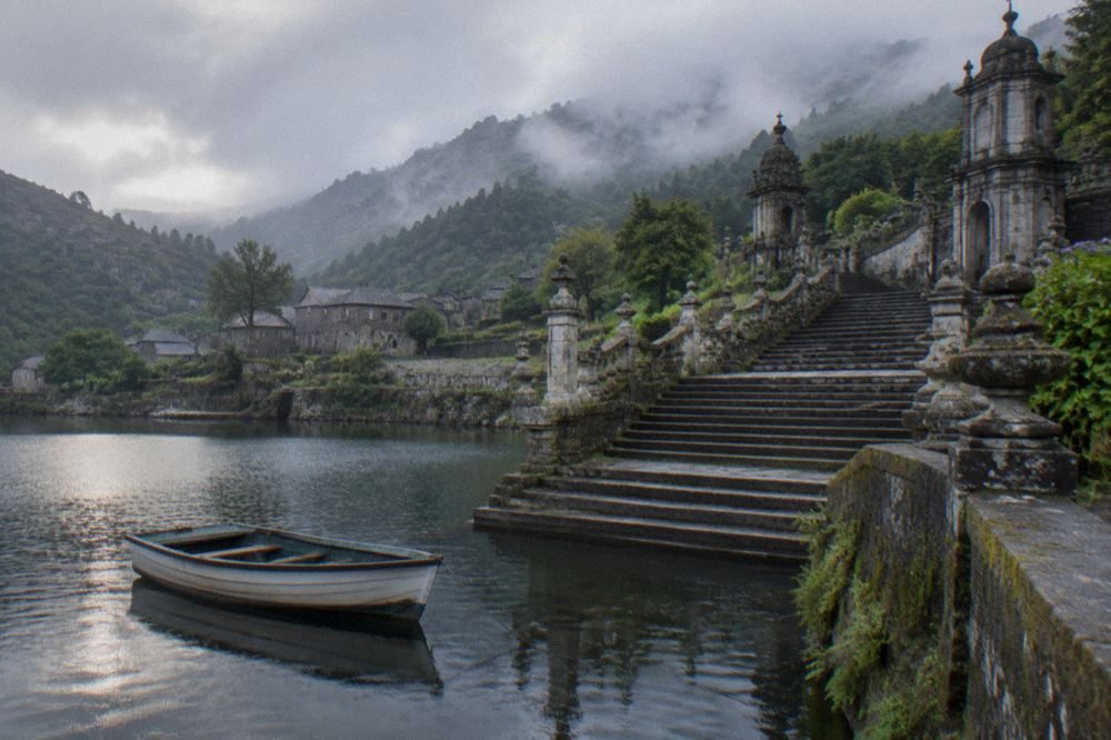 A rowboat floating on a small lake beside a monumental baroque staircase
