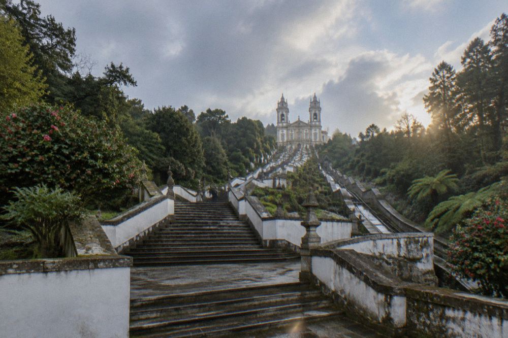 The baroque stairway of Bom Jesus do Monte zigzagging up the wooded hill above Braga