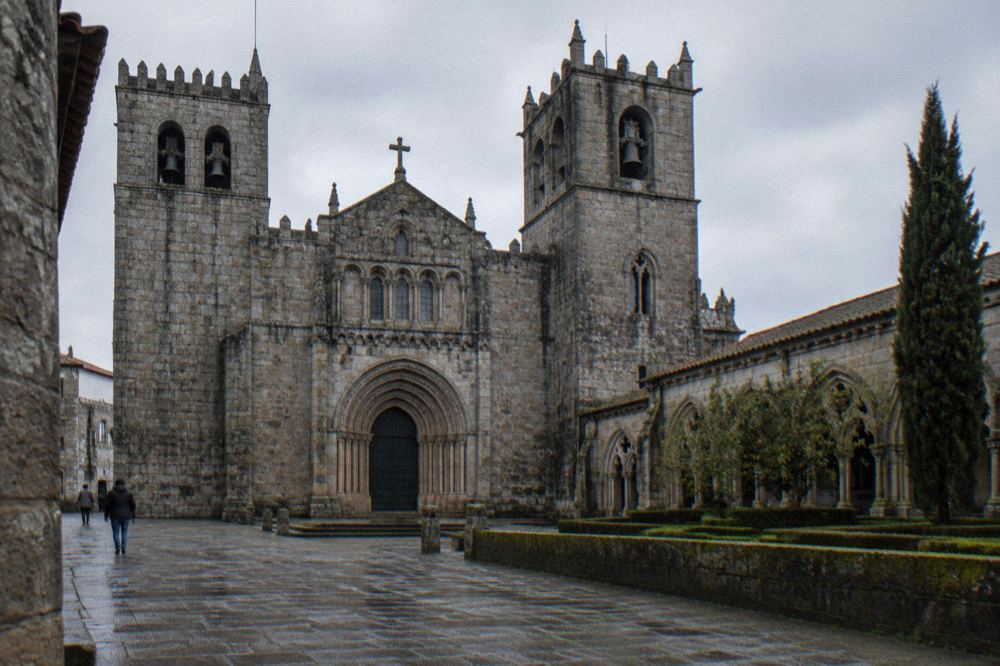 The Romanesque doorway and towers of Braga Cathedral seen from the square