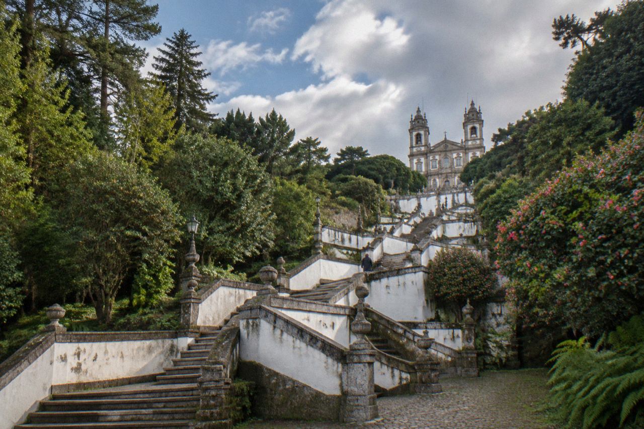 The baroque stairway and sanctuary of Bom Jesus do Monte rising above the trees above Braga