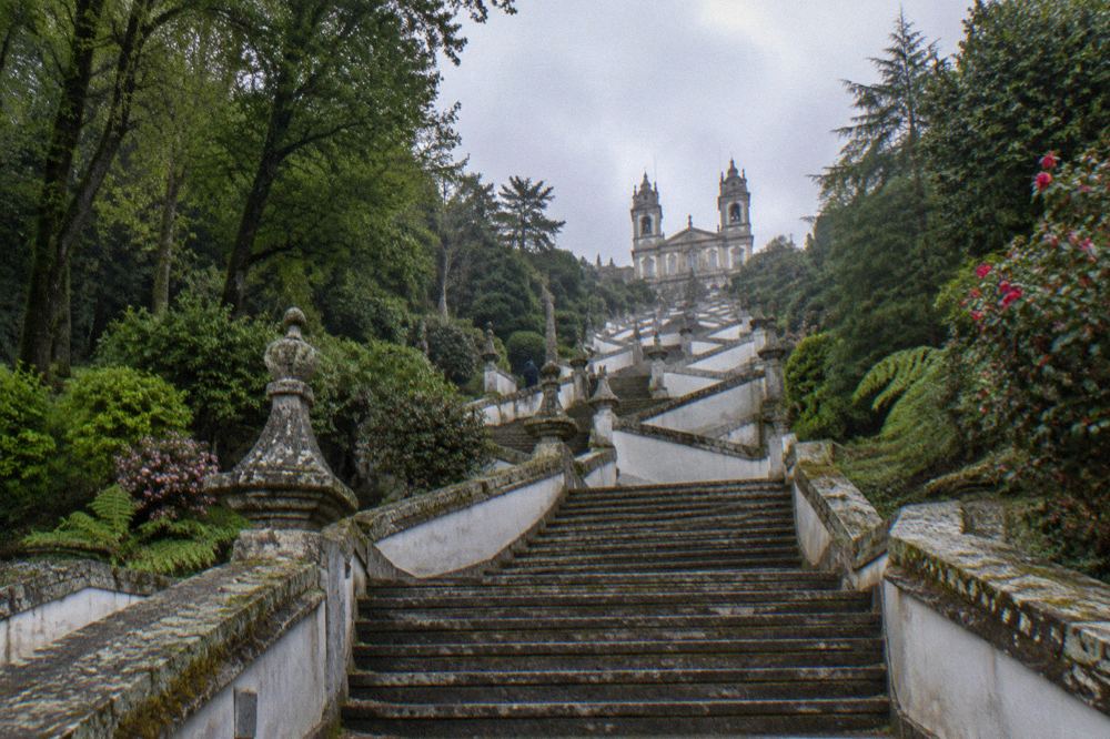 Stone staircase of the Bom Jesus sanctuary zigzagging up the wooded hillside
