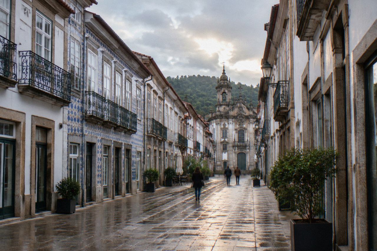 A quiet pedestrian street in Braga's historic centre with baroque buildings in daylight