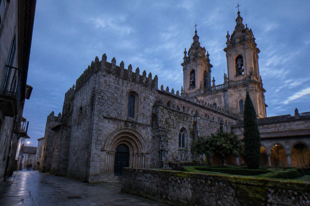 The baroque twin towers of Braga Cathedral seen from a narrow street