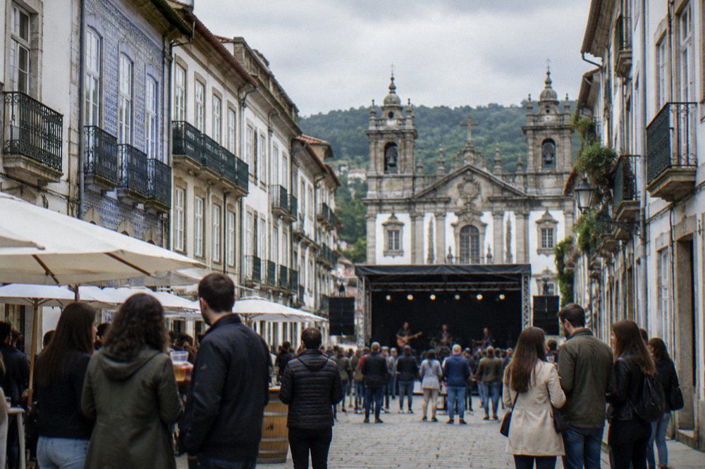 Two rows of festival goers comparing notes beside a street stage in a historic square