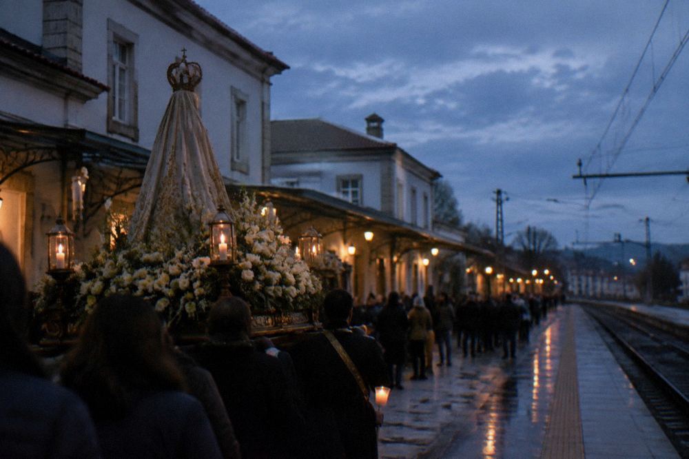 A decorated religious platform with candles carried through a night street lined with onlookers