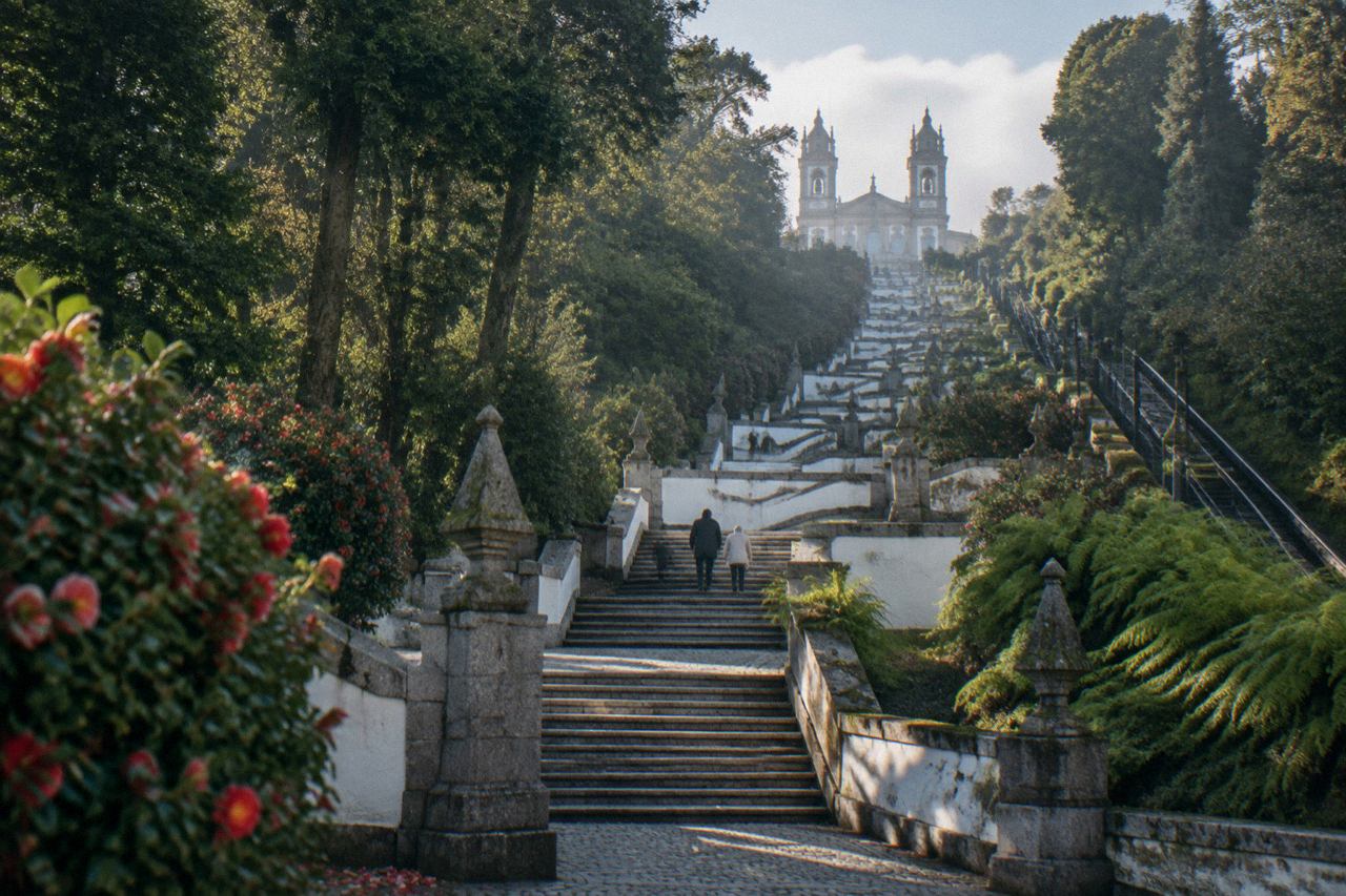 The baroque stairway of Bom Jesus do Monte rising through green woodland toward the sanctuary church