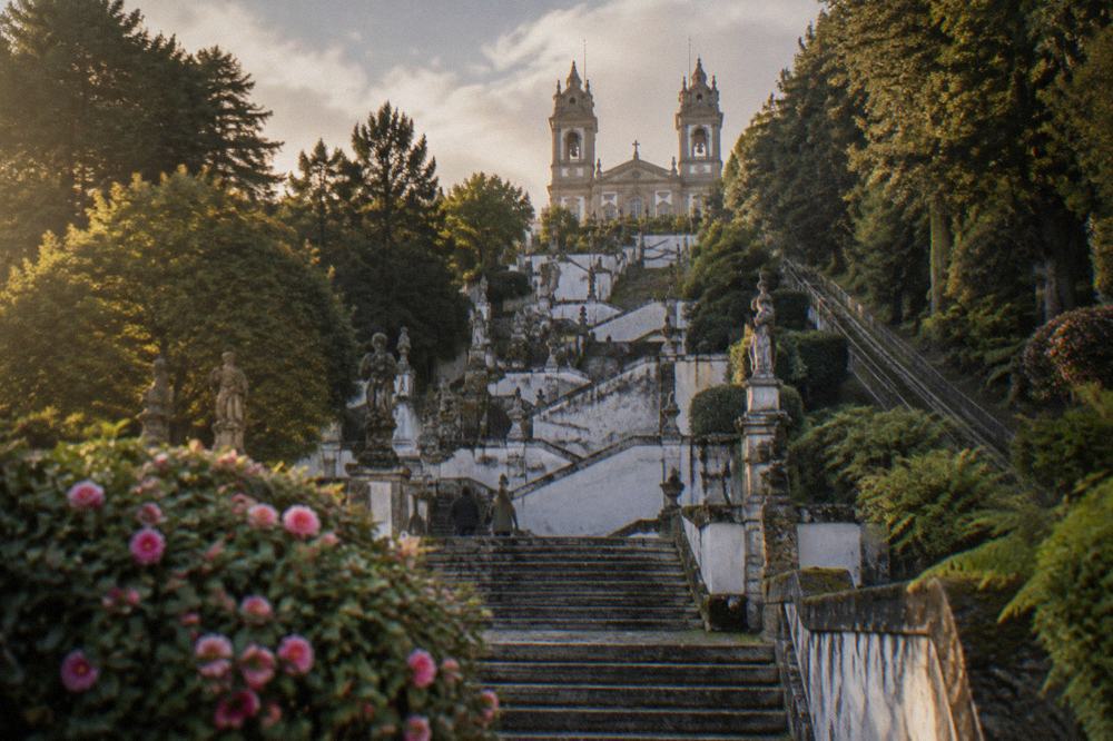 The zigzag stairway of Bom Jesus do Monte seen from below, with statues lining the balustrades