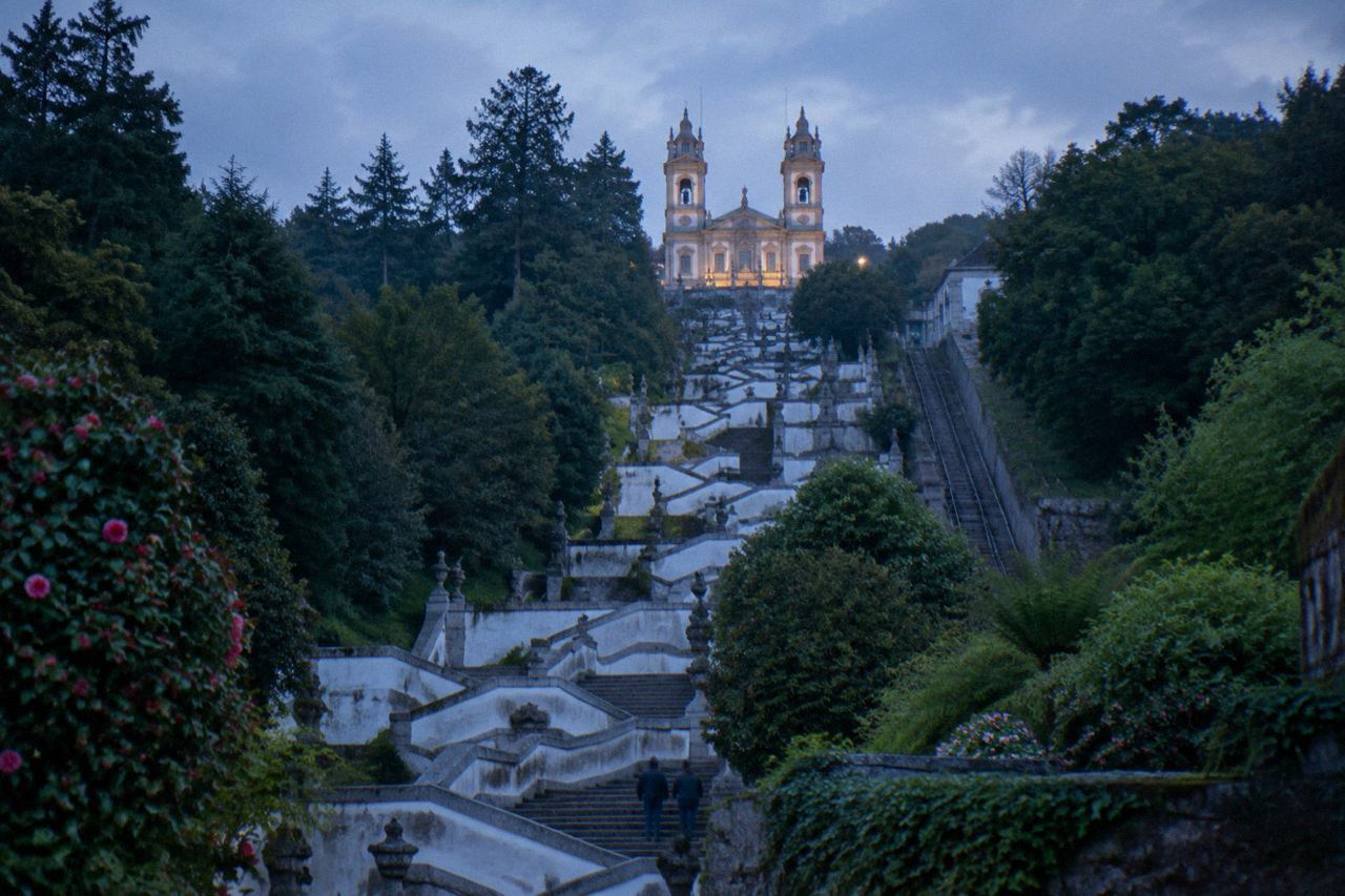 The baroque stairway and sanctuary of Bom Jesus do Monte rising above the wooded hillside above Braga