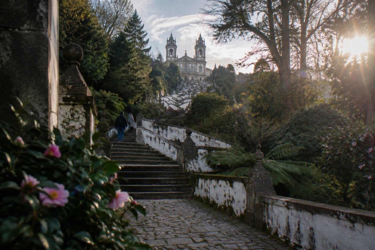 The baroque stairway and sanctuary of Bom Jesus do Monte rising above the wooded hill above Braga