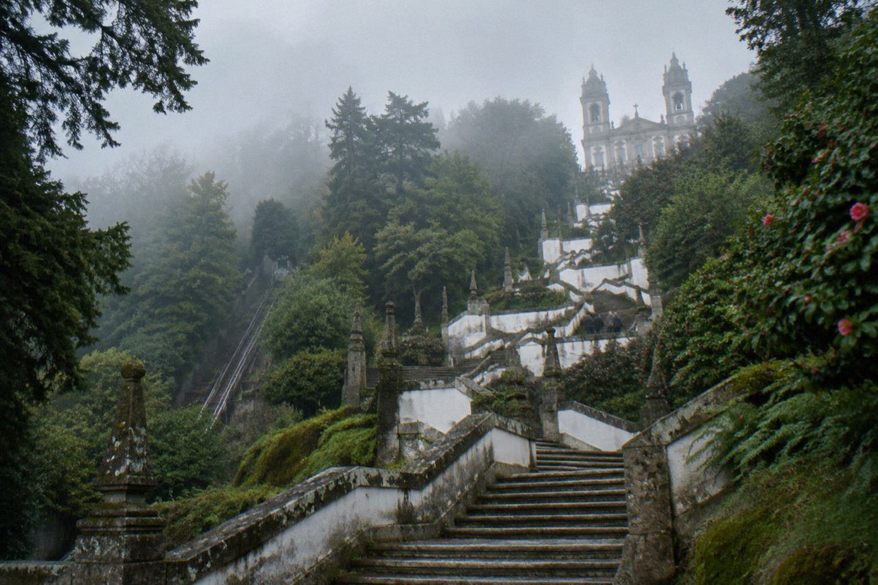 The baroque stairway and sanctuary of Bom Jesus do Monte rising above the wooded hill above Braga
